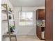 Bright office space with large window, desk, shelving, and lots of natural light at 3379 W Wagon Trail Dr, Englewood, CO 80110