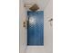 Updated walk-in shower featuring a blue accent wall in a herringbone pattern and bronze fixtures at 3379 W Wagon Trail Dr, Englewood, CO 80110