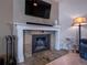 Close up of living room fireplace with modern decor at 16390 E Radcliff Pl # B, Aurora, CO 80015