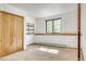 Bedroom featuring a double door closet, a window with a view, and neutral walls at 330 Ptarmigan St, Golden, CO 80403