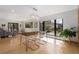 Stylish dining room with modern chandelier, wood table, translucent chairs, and lots of natural light at 330 Ptarmigan St, Golden, CO 80403