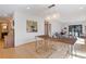 Dining room features a rustic wood table with lucite chairs and an ornate chandelier at 330 Ptarmigan St, Golden, CO 80403