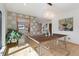 Dining room with view to kitchen, features modern chandelier and table arrangement at 330 Ptarmigan St, Golden, CO 80403