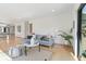Spacious living area with modern furniture, hardwood floors, and access to the dining and outdoor areas at 330 Ptarmigan St, Golden, CO 80403