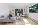 Beautiful living room with hardwood floors, stylish decor, and a sliding door at 330 Ptarmigan St, Golden, CO 80403
