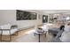 Bright and airy living area with hardwood floors, chic furniture, and a large window showcasing the outdoor view at 330 Ptarmigan St, Golden, CO 80403