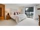 Bedroom with sliding glass doors leading to a deck, white walls, and neutral decor at 330 Ptarmigan St, Golden, CO 80403