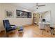 A bright office space with hardwood floors, large window, and built-in bookcase at 330 Ptarmigan St, Golden, CO 80403