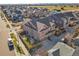 Aerial view of a two-story house in a residential neighborhood, showcasing backyard at 9091 E 59Th North Pl, Denver, CO 80238