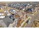 Aerial view of a house with a backyard, showcasing surrounding homes and landscape at 9091 E 59Th North Pl, Denver, CO 80238