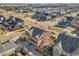 Aerial view showcasing a house's backyard and surrounding neighborhood at 9091 E 59Th North Pl, Denver, CO 80238