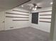 Unfinished basement with neutral carpeting and built-in shelving at 9091 E 59Th North Pl, Denver, CO 80238