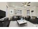 Spacious living room featuring a neutral color palette and ample natural light at 9091 E 59Th North Pl, Denver, CO 80238