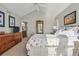 Comfortable bedroom boasts a vaulted ceiling, large dresser, and stylish decor at 3240 Spruce St, Denver, CO 80238