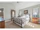 Serene bedroom with vaulted ceiling, a large mirror, and plenty of natural light at 3240 Spruce St, Denver, CO 80238