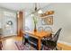Inviting dining area featuring a wooden table, bench seating, and decorative wall art at 3240 Spruce St, Denver, CO 80238
