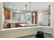 Contemporary kitchen with granite counters, stainless appliances and decorative lighting at 3240 Spruce St, Denver, CO 80238