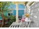 Cozy porch with a rocking chair and decorative accents at 3240 Spruce St, Denver, CO 80238