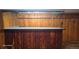 Basement bar area with wood paneling and unique bar top, ready for entertaining at 15600 E 33Rd Pl, Aurora, CO 80011