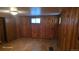 Cozy basement space with paneled walls, showing flexible potential for various uses at 15600 E 33Rd Pl, Aurora, CO 80011