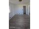 Bedroom featuring modern flooring, natural light from a window, and neutral wall colors at 15600 E 33Rd Pl, Aurora, CO 80011