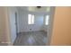 Bright bedroom with two windows and light wood flooring, freshly painted and ready for personalization at 15600 E 33Rd Pl, Aurora, CO 80011
