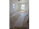 Bright bedroom featuring carpet, natural light from two windows, and neutral wall colors at 15600 E 33Rd Pl, Aurora, CO 80011