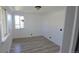 Bedroom featuring modern flooring, natural light from windows, and neutral wall colors at 15600 E 33Rd Pl, Aurora, CO 80011
