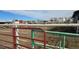 View of corral fencing enclosing a dirt area on a horse property, ensuring safety and confinement at 15600 E 33Rd Pl, Aurora, CO 80011