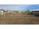 Picture of metal fencing enclosing a large dirt area, likely used as a horse pen or livestock area at 15600 E 33Rd Pl, Aurora, CO 80011