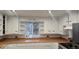 Bright kitchen with white cabinets, updated appliances, and wood countertops at 15600 E 33Rd Pl, Aurora, CO 80011