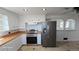 Well-lit kitchen featuring modern appliances, bright countertops and backsplash and ample storage at 15600 E 33Rd Pl, Aurora, CO 80011