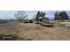 Large property with a mix of equipment and vehicles, showcasing the land's versatile usage at 15600 E 33Rd Pl, Aurora, CO 80011