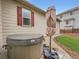 Back exterior featuring hot tub, umbrella and rock landscaping at 22466 E Layton Cir, Aurora, CO 80015