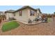 Back exterior featuring patio seating, hot tub, lawn area and rock landscaping at 22466 E Layton Cir, Aurora, CO 80015
