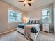Comfortable bedroom featuring ample natural light, carpet, and neutral paint at 22466 E Layton Cir, Aurora, CO 80015