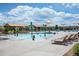 Resort-style community pool featuring lounge chairs, splash fountains, and plenty of space for residents at 22466 E Layton Cir, Aurora, CO 80015