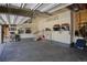 Clean two-car garage offering ample storage space, shelving, and organization for tools and equipment at 22466 E Layton Cir, Aurora, CO 80015