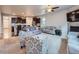 Bright living room with hardwood floors, a fireplace, and an open floor plan at 22466 E Layton Cir, Aurora, CO 80015