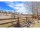 Beautiful backyard view with a wooden fence and expansive hill at 11274 W 54Th Ln, Arvada, CO 80002