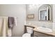 Elegant bathroom with a stylish vanity, framed mirror, and tasteful decor at 11274 W 54Th Ln, Arvada, CO 80002