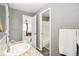 En-suite bathroom with granite counters and access to the bedroom and shower at 11274 W 54Th Ln, Arvada, CO 80002