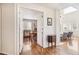 Hallway with hardwood flooring leading into a furnished office space at 11274 W 54Th Ln, Arvada, CO 80002