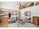 Open-concept living room with a view of the kitchen and second story at 11274 W 54Th Ln, Arvada, CO 80002