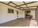 Enclosed back porch features a wooden deck, white walls, and a sliding door to the backyard at 1599 S Telluride St, Aurora, CO 80017