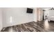 Bedroom offers hardwood floors, ample space, and modern barn door access to the walk-in closet at 1599 S Telluride St, Aurora, CO 80017