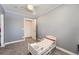 bedroom featuring a twin bed and a closet in a gray room at 1599 S Telluride St, Aurora, CO 80017