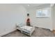 Bright bedroom featuring neutral tones and a window providing natural light at 1599 S Telluride St, Aurora, CO 80017