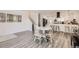 Open dining area flows seamlessly into a modern kitchen, showcasing a harmonious and inviting living space at 1599 S Telluride St, Aurora, CO 80017