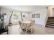 Open dining area with hardwood floors, natural light, and view of the entry at 1599 S Telluride St, Aurora, CO 80017